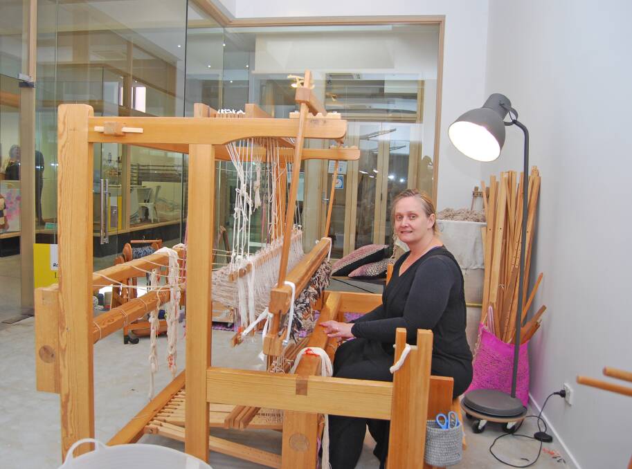 Weaving a future: Deb Weston at her Swedish floor loom in the Block Arcade. Picture: Ray White Real Estate.