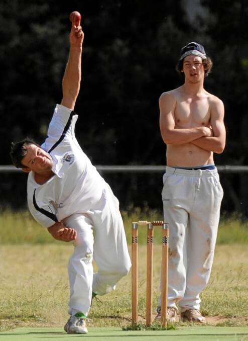 Gotta love country cricket. Newlyn's Chris Stevens bowls beside half-naked umpire and team-mate Josh Cowan. 