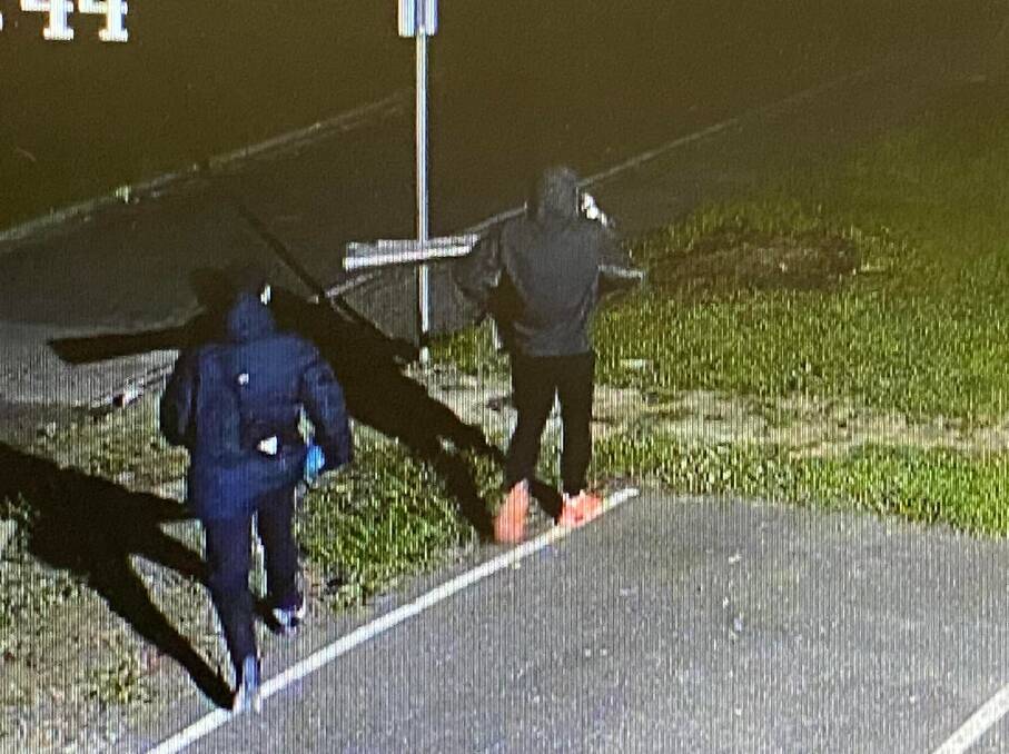 Suspects: Two people caught on camera leaving the school.