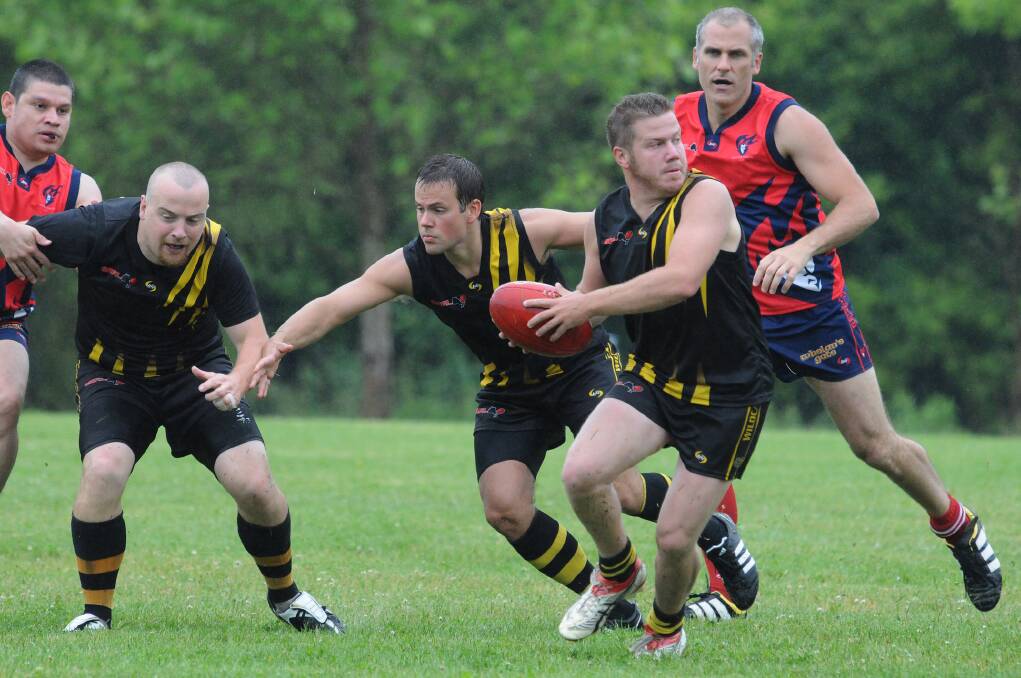 Bringing Ballarat to the world: Tim Wilson breaks from the pack in an AFL Canada match. Aside from his distilling and brewing, he promotes the game in Canada.