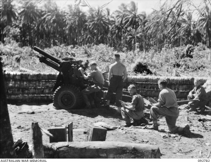 Long range: a battery of the 4th Field Regiment in action on Bougainville. Picture: Australian War Memorial