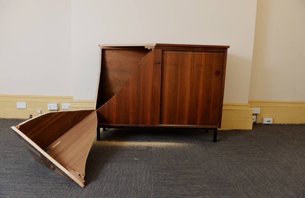 Cornered: This cabinet is broken open and sawdust marks the cut site. Picture: Kate Healy.