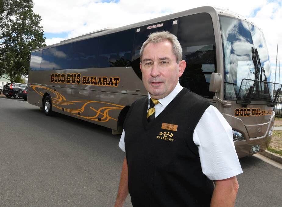 Harrowing: David Hustwaite with the sister bus to the one he was driving to Geelong on Sunday morning. Picture: Lachlan Bence.