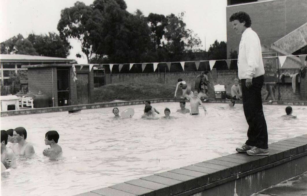 Ballarat Grammar: Teacher Priscilla Herrington watches students in the outdoor pool, 1970s.