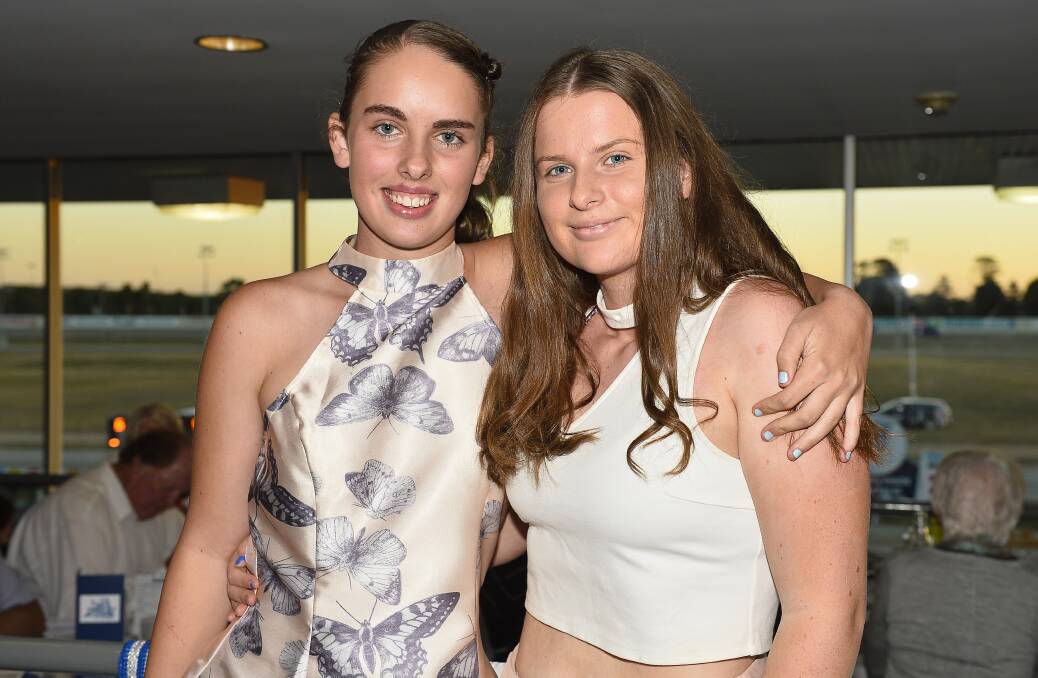 Keely Reid and Skylar Reid took the opportunity to dress up at the 2017 Ballarat Pacing Cup. Picture: Dylan Burns.