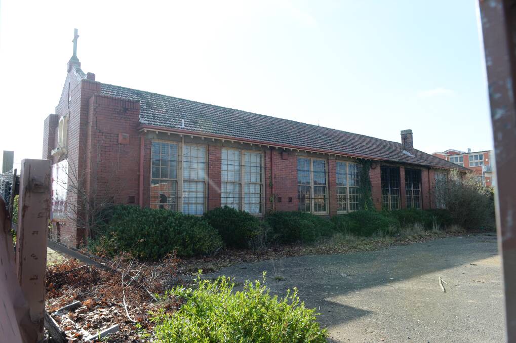 To be retained: This former school music hall will become a feature of the development.