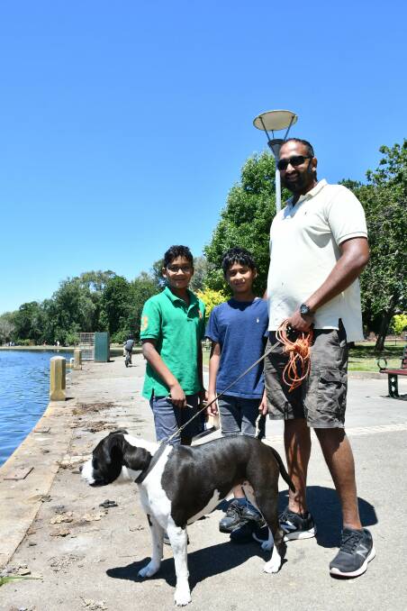 Family holiday: Krish with his sons Isaiah and Josiah and their dog BJ at Lake Wendouree. They are holidaying from Clarinda. Picture: Caleb Cluff.