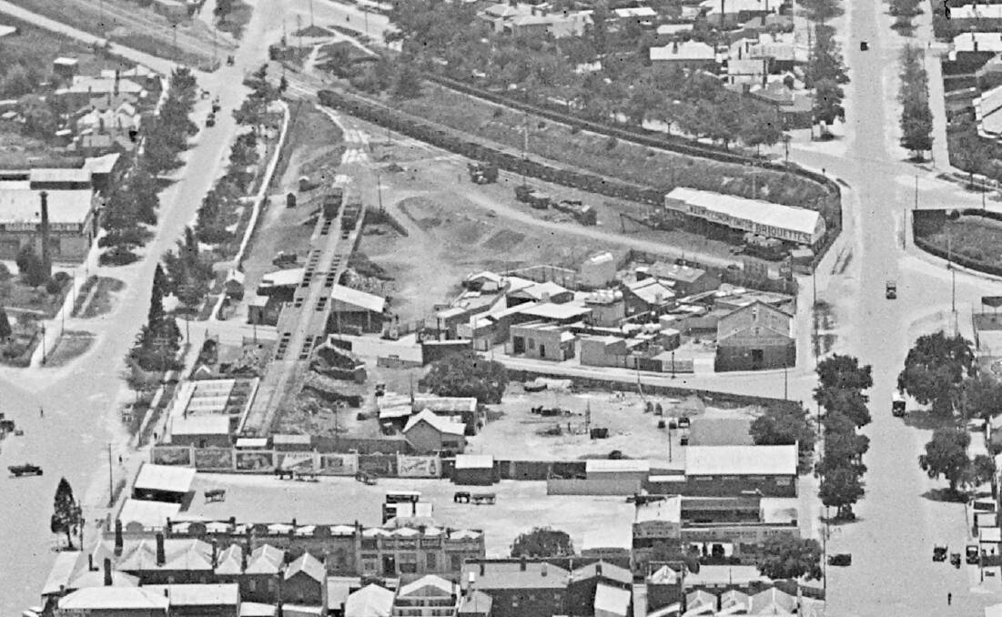 The Market Square site in the 1920s or 1930s. terraces can be seen fronting Mair Street on the left, opposite The Royal Highlander Hotel; an unidentified brick building is on the corner of Mair and Armstrong, opposite Campagna Cellars today.