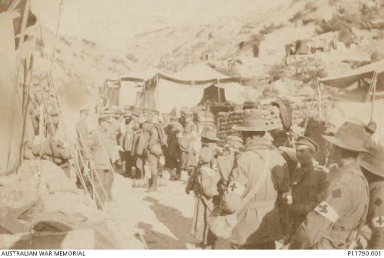 The last of it: Australian and New Zealand troops await embarkation. Picture: Australian War Memorial P11790.001