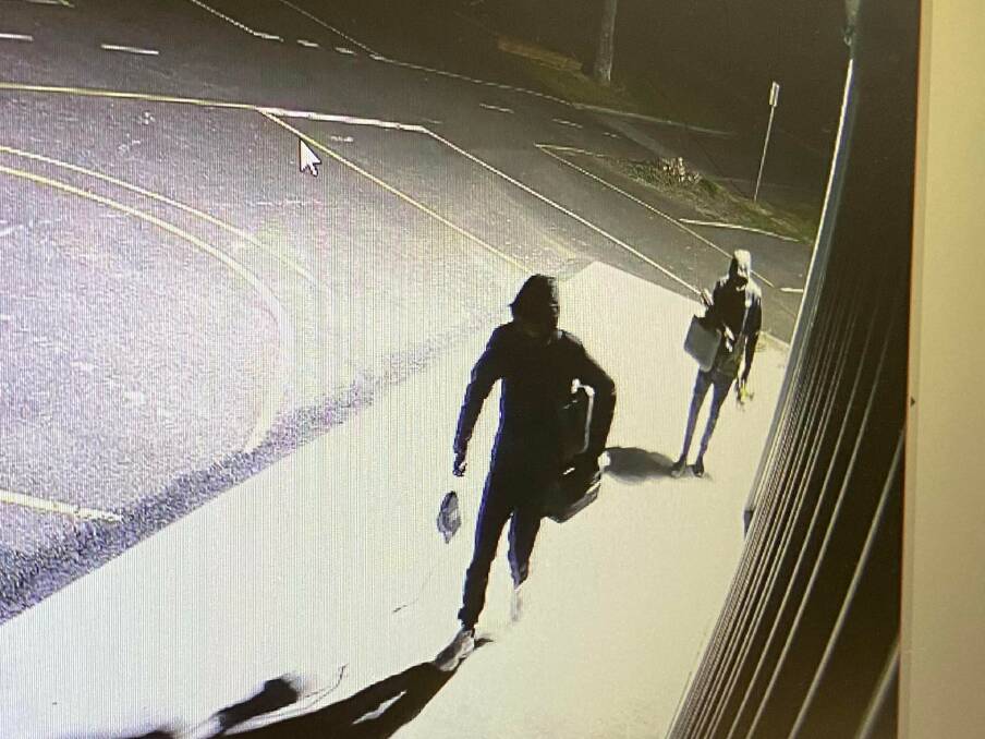 Theft: Suspects leaving the school shed with tools and equipment.