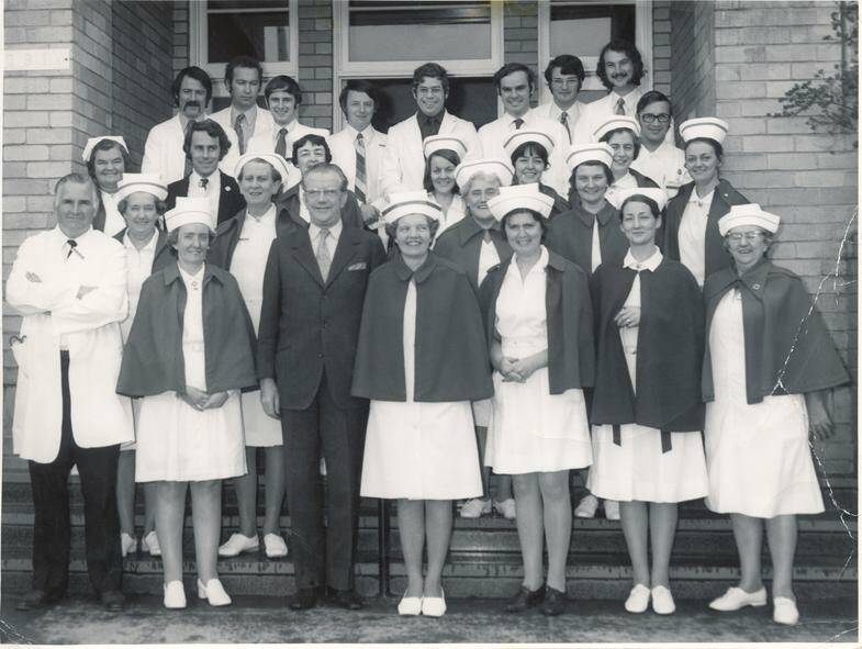 A long history: Medical senior & junior medical residents and senior nursing staff stand on Eildon House stairs in 1973. Front L-R: Dr J. Acheson (Medical Sup), Sr Betty Wilson (Dep Matron), Mr I. McVilly (Manager), Miss M.S. Ogden (Matron), Sr Winsome Menadue (Asst Matron), Sr M. Ormsby (Clinical Sup), Sr Grace Cameron (Midwifery Sup). Picture: SLV