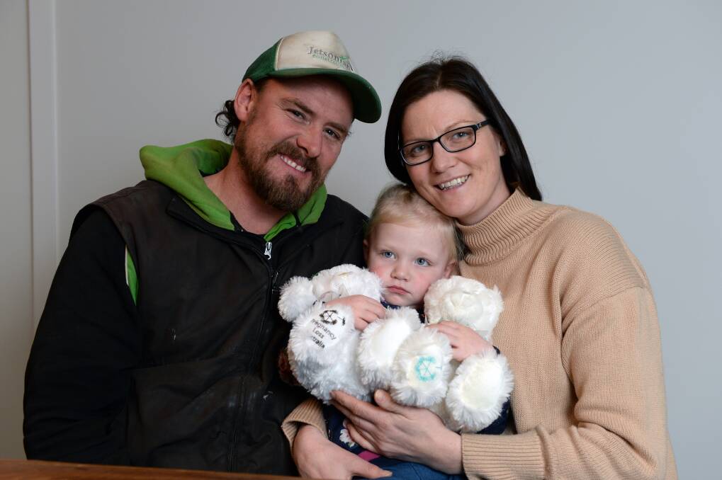 From tragedy to knowledge and understanding: Scott and Hana Baker with their daughter Honora. The Bakers are raising money to further research into neonatal death following the loss of their daughters Aoife and Florence. Picture: Kate Healy.