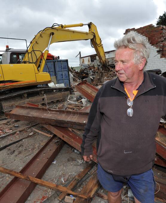 Era's end: Alan Barrett stands amidst the building's remains on Wednesday. His father William bought the site in the 1970s. Picture: Lachlan Bence.
