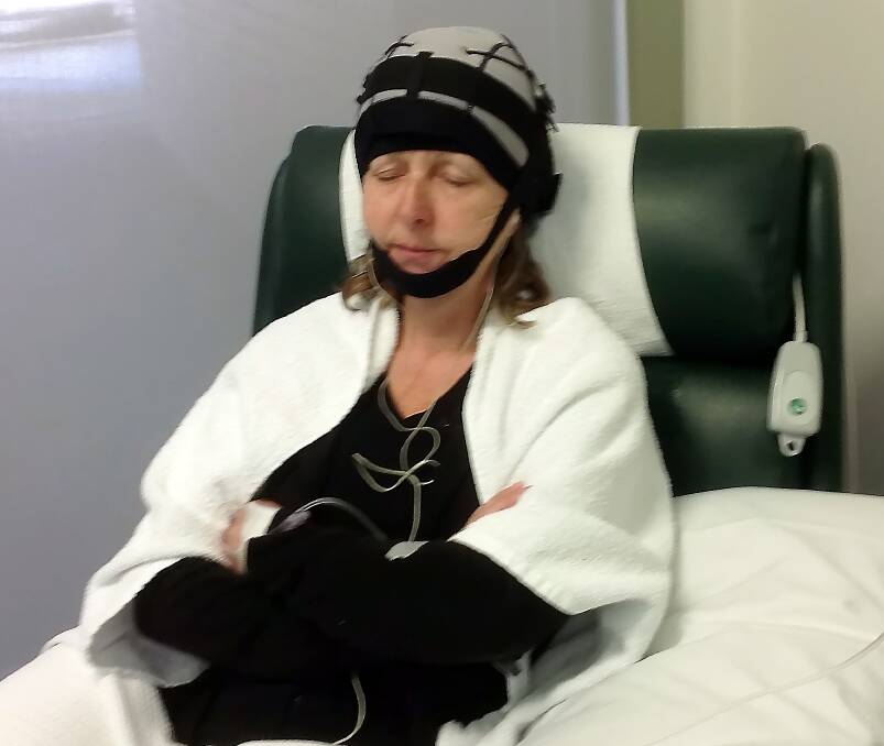 Scalp cooling: Lorraine undergoing chemotherapy with the cooling unit in place. Photo: David Gillard.