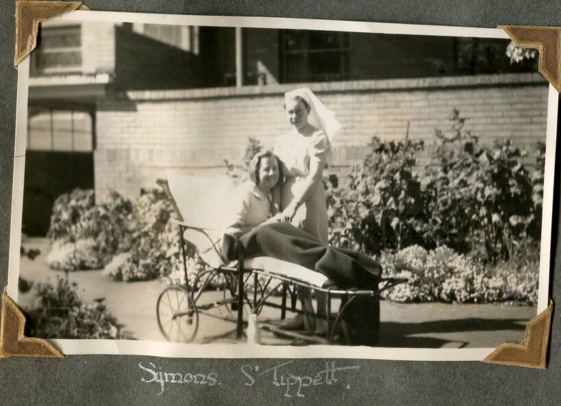 Outdoor gardens: Patient Symons and Sister Tippett in the gardens of the Eildon House building, 1930s/40s.