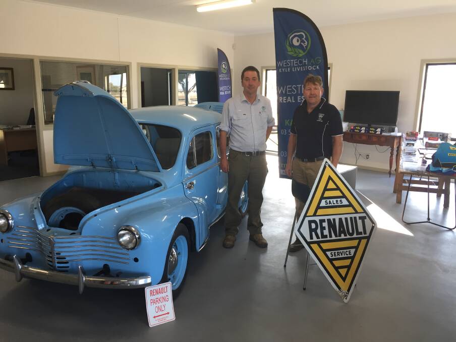 AUCTION: Westech Real Estate's Stuart Kyle and Hamish Mines set up a display for Roger Mines' online Renault estate auction. Picture: CONTRIBUTED