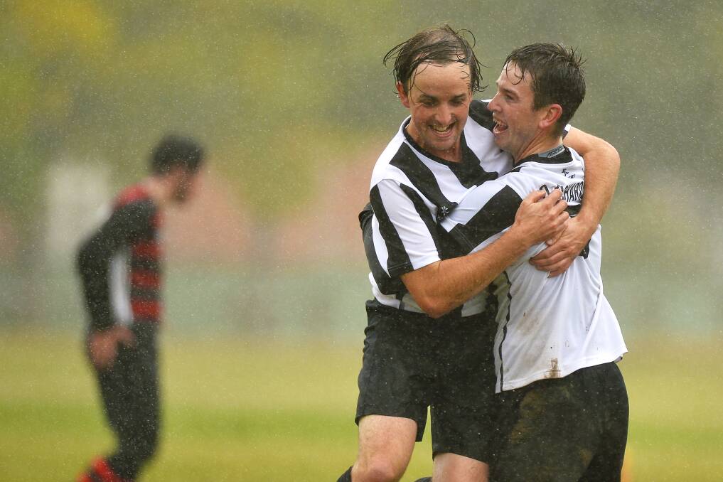 GOAL: Ballarat North United teammates Tim Beggs and Oliver Richardson celebrate one of the team's four goals in its loss to Buninyong on Sunday.