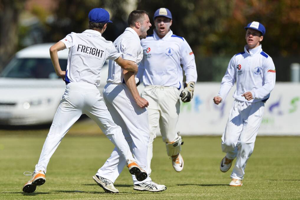 ONES TO BEAT: Golden Point's Andrew Warrick, who has now left the club, and teammates celebrate a big wicket in last season's grand final victory. Picture: Dylan Burns