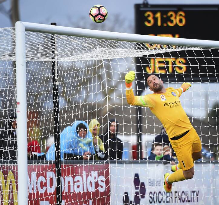 CLOSE CALL: Melbourne City goal keeper Dean Bouzanis watches this one fly over the bar in what was a tough day in defence.