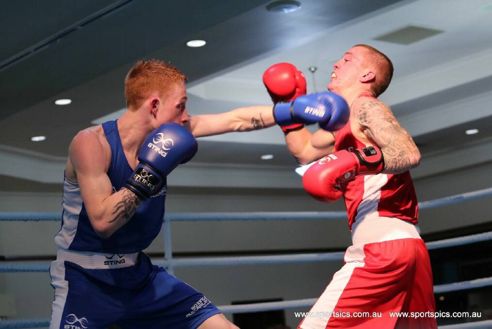CHAMPION: Jack Denahy lands a punch on his opponent during the Elite Men’s Australian light weight boxing championship. Picture: Sportspics
