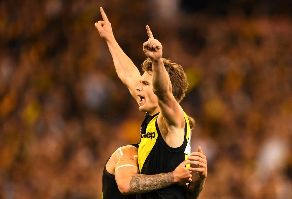 WE'RE ON OUR WAY: Richmond's Dan Butler celebrates after kicking a goal against the Giants in Saturday's preliminary final. Picture: AAP Image/Julian Smith.