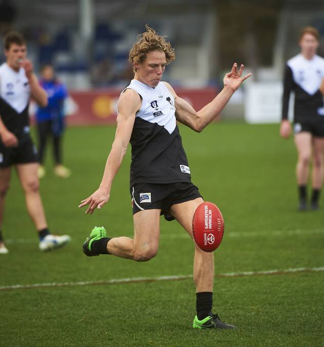 ENERGY: North Ballarat youngster Jake McQueen slots a goal against Port Melbourne. The Roosters will require plenty from its young brigade on Saturday.