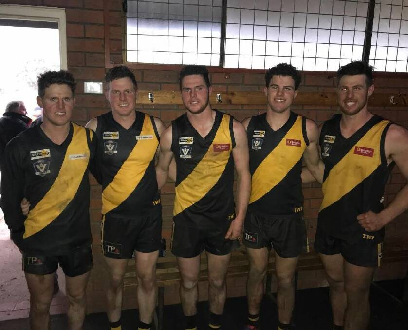 RARE FEAT: Brothers Terry, Karl, Brett, Kieran and Joel Maher all pulled on the Springbank jumper for the first time together on the weekend. Picture: Tim O'Connor.