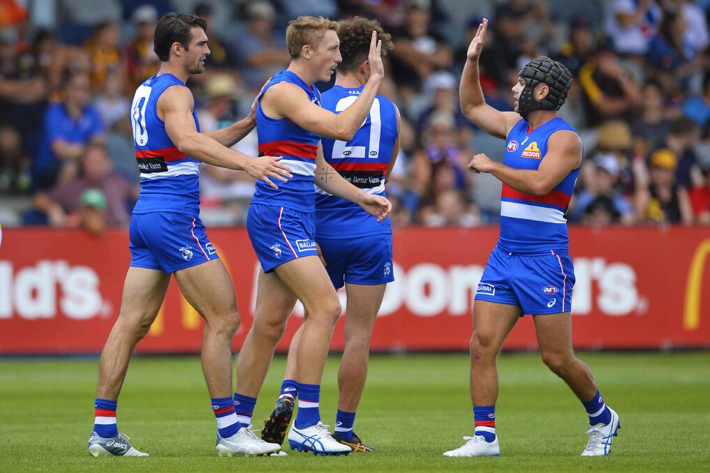 Western Bulldogs players celebrate a goal during this year's JLT Community Series match.