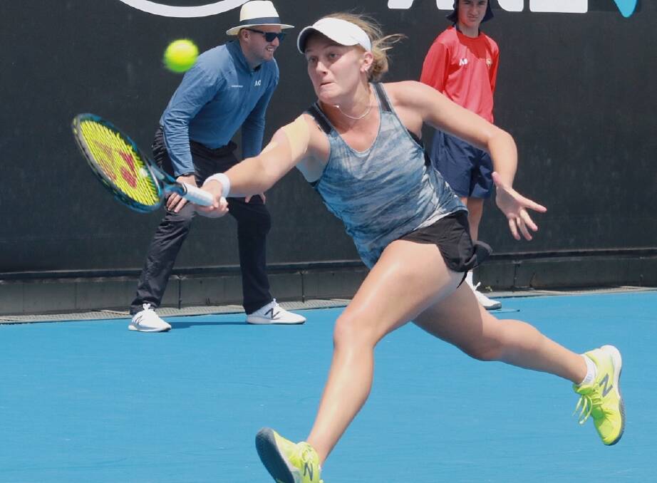 ON THE STRETCH: Ballarat's Zoe Hives reaches for the ball during Wednesday's match against world number 19 Caroline Garcia at Melbourne Park.