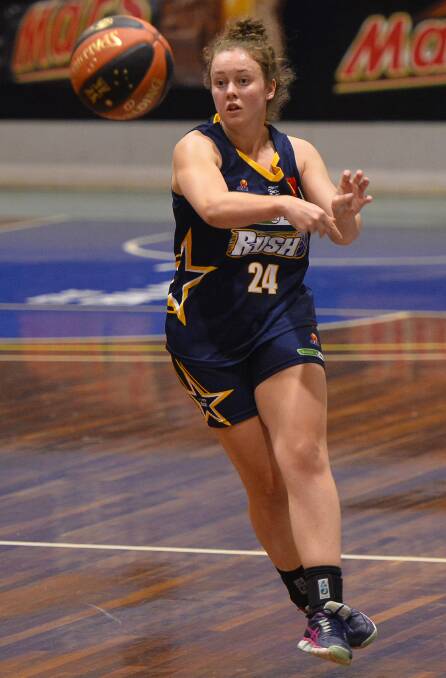 BACK ON COURT: Ballarat Rush's Claire Constable sends a pass down the court against Melbourne Tigers - Ballarat went down 93-81, after three weeks off. Pictures: Dylan Burns