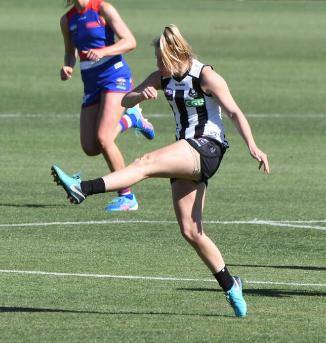 LONG BALL: Collingwood's Kristy Stratton surges the ball forward during Saturday's match at Mars Stadium, the Magpies falling just short.