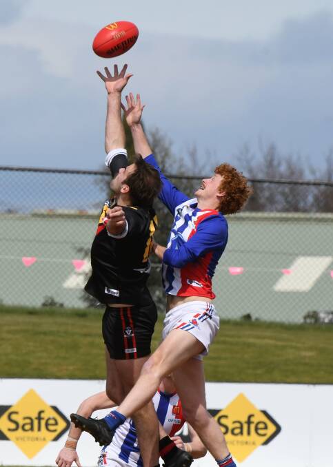 CONTEST: East Point's Andrew Stevenson spoils against his Bacchus Marsh opponent, the Cobras dominated the air in the reserves grand final. Pictures: Lachlan Bence 