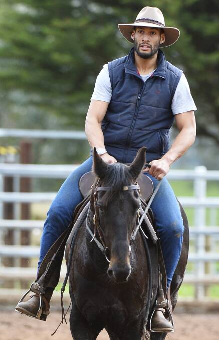 Hawthorn's Josh Gibson enjoys his week off participating in a team penning event in Waubra.