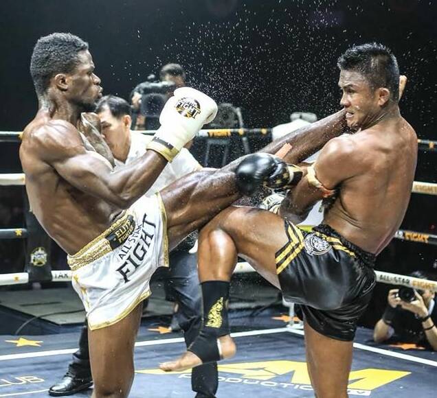 GOING THE DISTANCE: Ballarat's Victor Nagbe held his own against champion kickboxer Buakaw Banchamek during their fight. Picture: All Star Fight