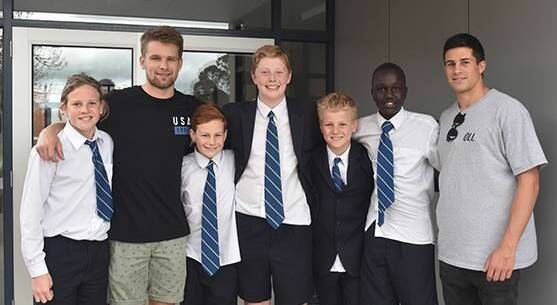 Richmond's Dan Butler (second from left) and West Coast's Liam Duggan (far right) with the St Patrick's College students. Picture: St Patrick's College.