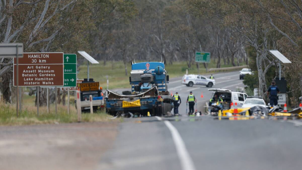 The scene: Police and emergency services at the crash at the foot of Mount Sturgeon. Picture: Mark Witte
