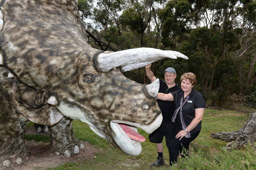 Paul and Lisa Sperber with the animatronic Triceratops. Picture: Kate Healy