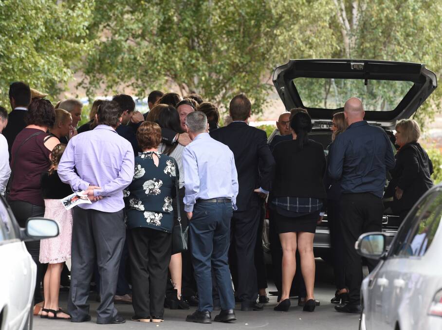 Hundreds of mourners send off Jack Brownlee at his funeral.
