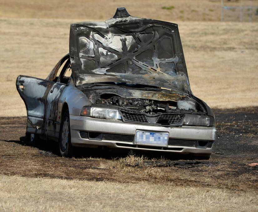Another car burnt.