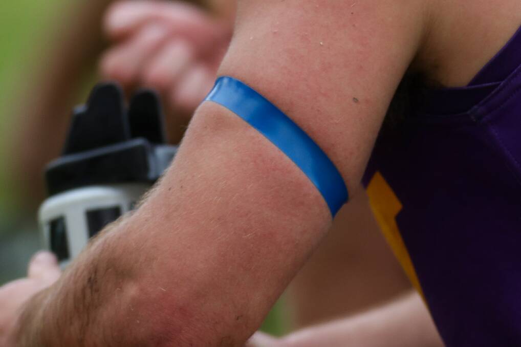 Football players wear blue tape to show support for Beyond Blue. Picture: Morgan Hancock