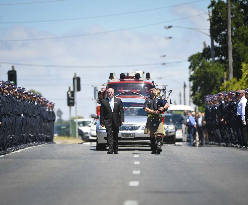 RESPECT: A guard of honour is formed by firemen and soldiers in December, 2016 to farewell Nathan Shanahan. Picture: Dylan Burns