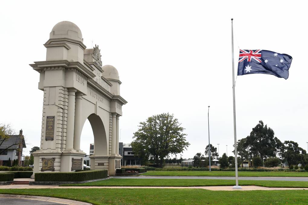 Australian flag at half-mast at the Arch of Victory on Remembrance Drive in memory of the police officers killed in a car crash in Melbourne. Picture Adam Trafford