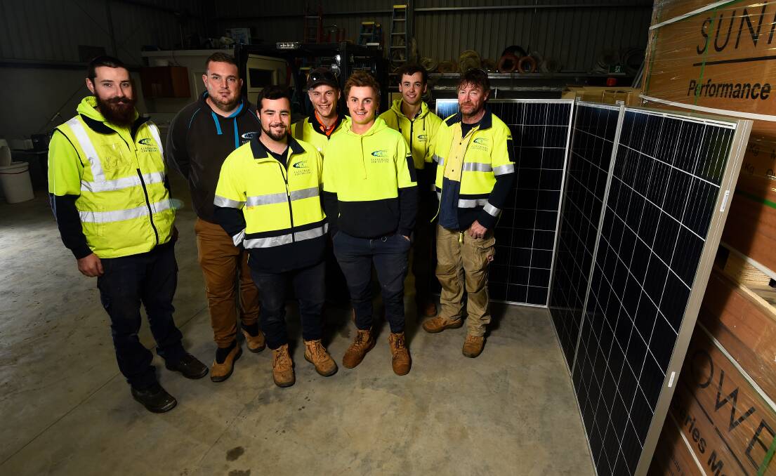 Ballarat electrical contractors Widgery and Wilson operations manager Ricky Ryan (second from the left) with workers who have so far installed about 100 solar systems through the program. Picture: Adam Trafford