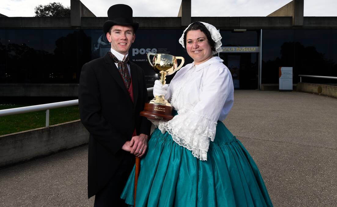 Scott Henderson and Lucy McNeil pose with the Melbourne Cup at Sovereign Hill. Picture: Adam Trafford