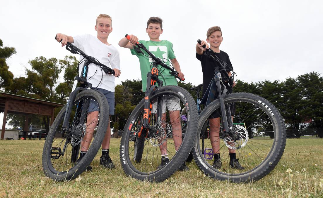 Lachlan Petrie, 11, Nick Birkin, 13, and Oscar Price, 13, want a fun place to ride closer to home. Picture: Kate Healy