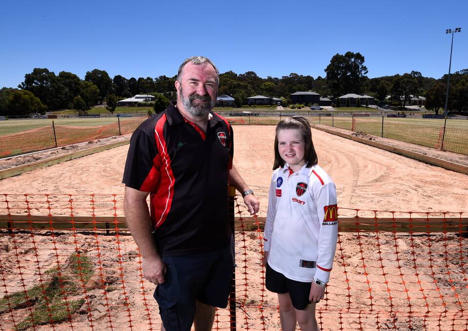 EXCITING TIMES: Club secretary Chris Gordon with
junior player Tilly. Picture: Adam Trafford.