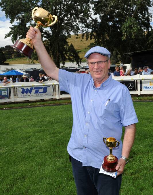 GOOD TIMES: Robert Smerdon holds the 2017 Ballarat Cup in the air after he won the race with Grand Dreamer during November last year.