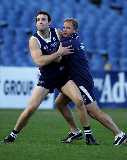 HIGH LEVEL: Watt (right) battles Geelong's Brad Ottens in 2005.
