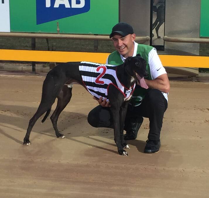 HAPPY: Jason Thompson, the husband of Seona, with Aston Kimetto after his impressive heat win. The dog has drawn box three for the Ballarat Cup final next weekend. Picture: Daniel Short.