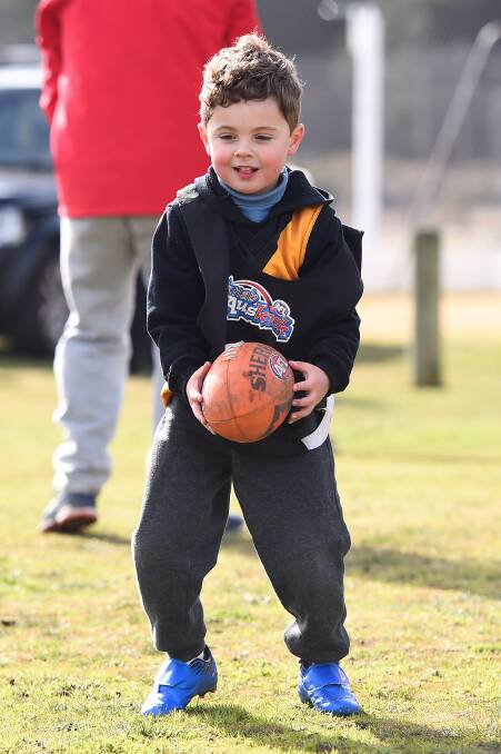 FUN: Darcy is pictured in action during the first week of Auskick in July.